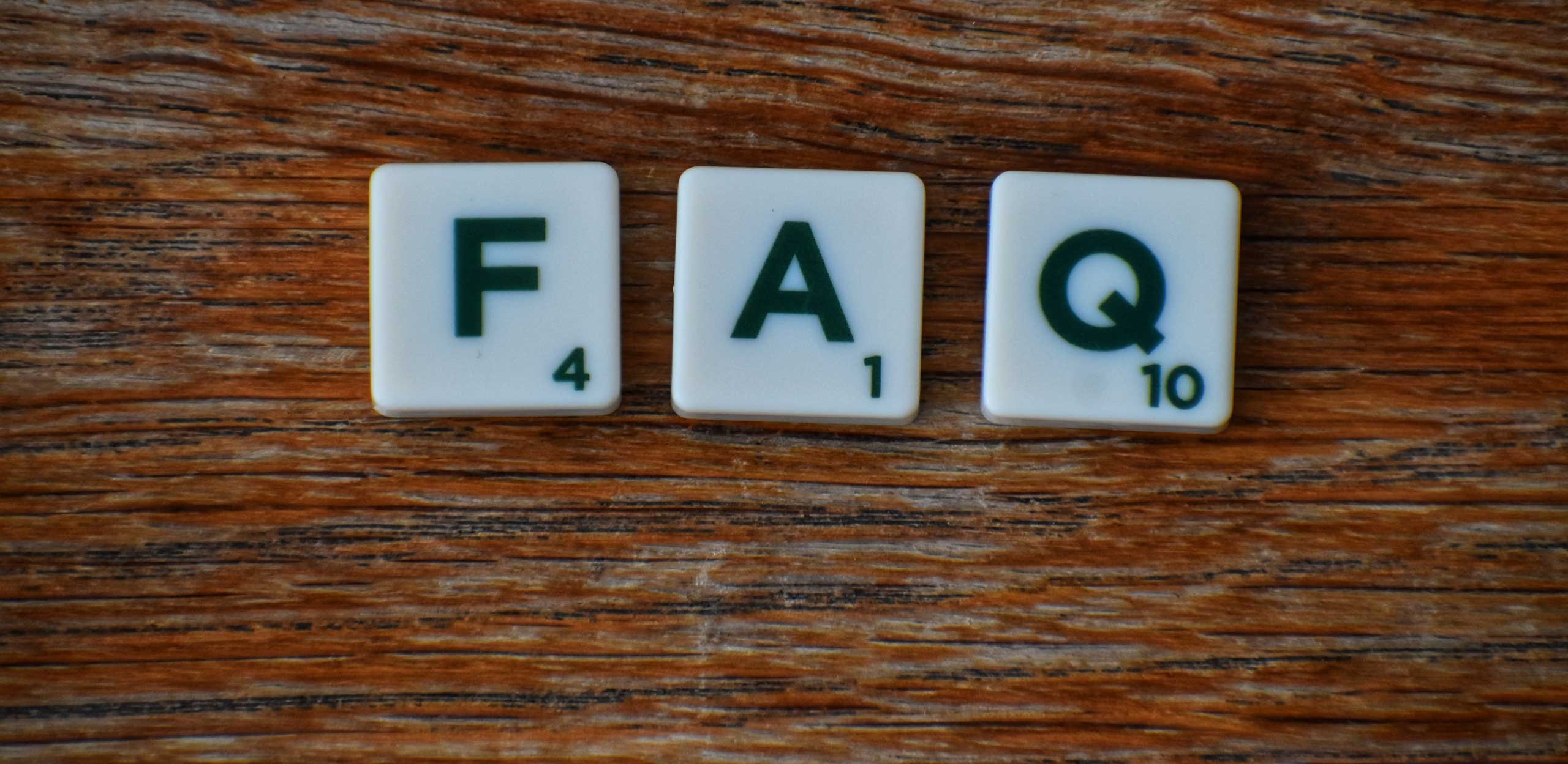 Scrabble tiles of F,A and Q